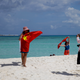 FILE - In this Sept. 14, 2014 file photo, Chinese tourists take souvenir photos with the Chinese national flag as they visit Quanfu Island, one of Paracel Islands of Sansha prefecture of southern China's Hainan province in the South China Sea. Two state-owned companies have announced plans to develop floating nuclear reactors for use by oil rigs or island communities. If they succeed, the achievement would raise concern the reactors might be sent into harm’s way to support oil exploration in the South China Sea, where Beijing faces conflicting territorial claims by neighbors including Vietnam and the Philippines. (AP Photo/Peng Peng, File)